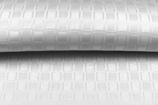 Weißes Abstandsgewirke mit Karo-Struktur 
